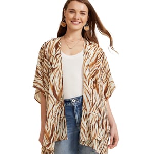 A short-sleeve, lightweight kimono wrap with a brown and cream zigzag pattern over a white top and blue jeans.