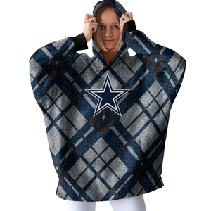 A person wears a plaid-patterned wearable blanket hoodie featuring a navy blue star logo on the front.
