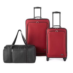 Red luggage set with two upright suitcases featuring telescopic handles and four spinner wheels, accompanied by a black duffel bag.