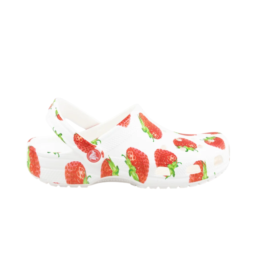 White slip-on clogs featuring a strawberry pattern with a pivoting heel strap.