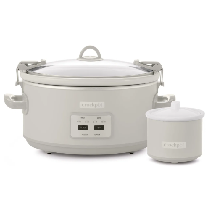 A Crock-Pot slow cooker with a digital control panel and locking lid, accompanied by a smaller dipper warmer.