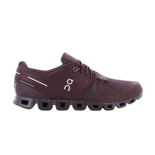 A maroon athletic shoe with a unique cushioned sole, featuring the brand's logo and Swiss engineering details.