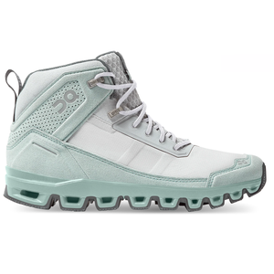 A light gray and mint high-top sneaker with a rugged sole, featuring a modern design and perforated detailing on the ankle.