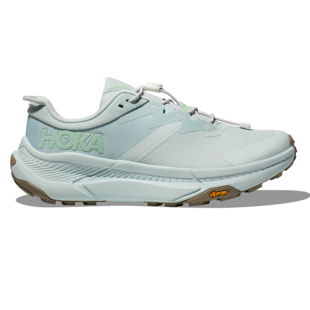 Light blue Hoka running shoe featuring a Vibram outsole and cushioned midsole, designed for comfort and traction.