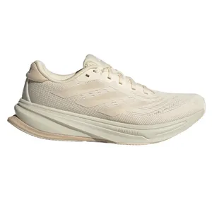 Cream-colored Adidas running shoe with a lightweight mesh upper and cushioned sole featuring \“DREAMSTRIKE\“ technology. Subtle three-stripe branding on the side.