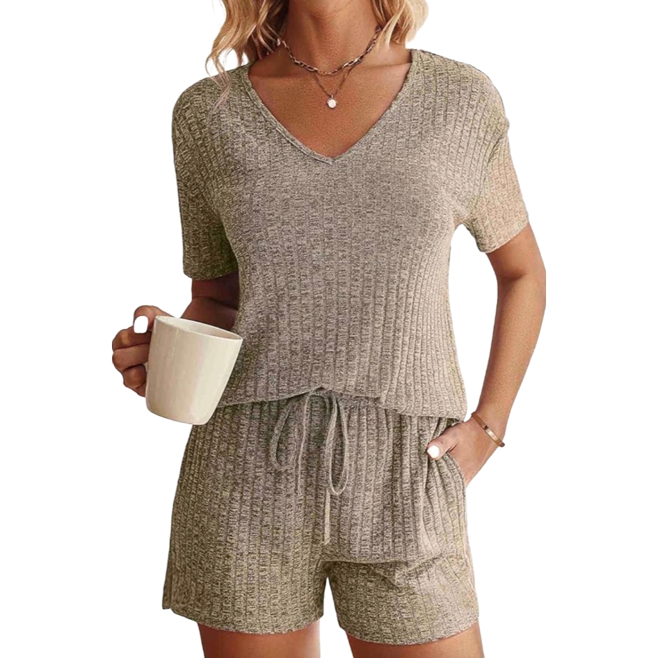 A ribbed-knit lounge set featuring a short-sleeve V-neck top and drawstring shorts in a soft, textured fabric. The set is a neutral tone, suitable for casual or lounging activities.