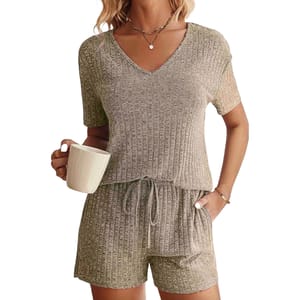 A ribbed-knit lounge set featuring a short-sleeve V-neck top and drawstring shorts in a soft, textured fabric. The set is a neutral tone, suitable for casual or lounging activities.
