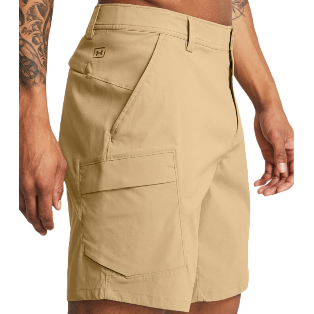 Under Armour Fishing Cargo Shorts in beige, featuring a zippered fly, belt loops, angled front pockets, and a large cargo pocket on the side for extra storage.