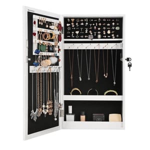 A wall-mounted mirror jewelry cabinet with a black interior organizes various accessories, including earrings, necklaces, bracelets, and rings. It has a locking mechanism with keys for added security.