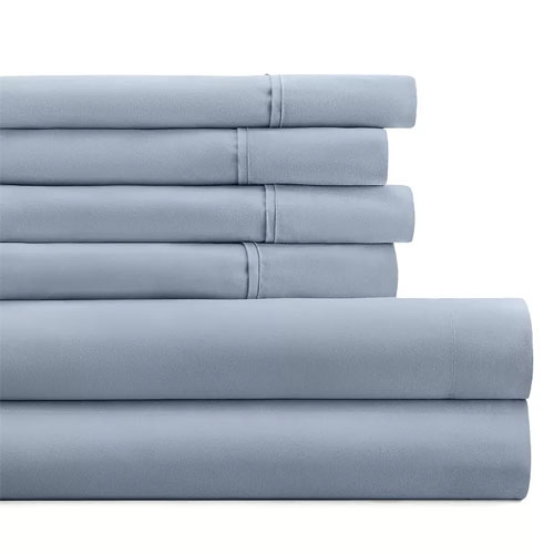 A neatly stacked set of blue bed sheets, including pillowcases and possibly flat and fitted sheets.