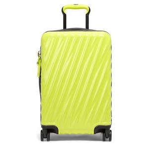 Neon yellow hard shell suitcase with a ridged texture and retractable handle.