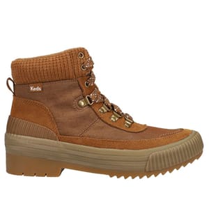 A brown high-top boot with a thick sole and lace-up design, featuring metal eyelets and a ribbed ankle collar, branded as Keds.
