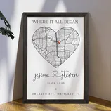Framed map art with a heart shape featuring a location marker, personalized with the names \“Jessica\“ and \“Steven,\“ a date (11.09.2025), and the address \“Orlando Ave. Maitland, FL,\“ with the phrase \“Where It All Began.\“