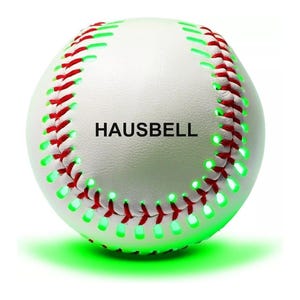 A white baseball with red stitching featuring embedded green LED lights, branding \“HAUSBELL\“ printed on its surface.