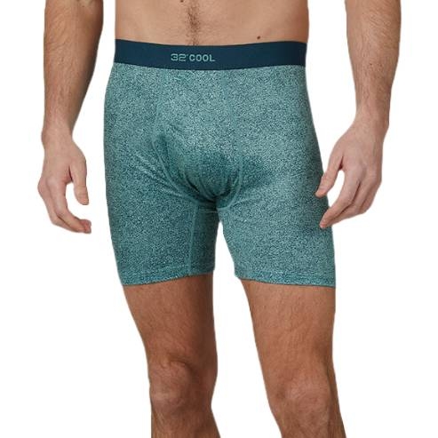 A man is wearing teal boxer briefs with a dark waistband that features the brand name \“32 Degrees Cool.\“