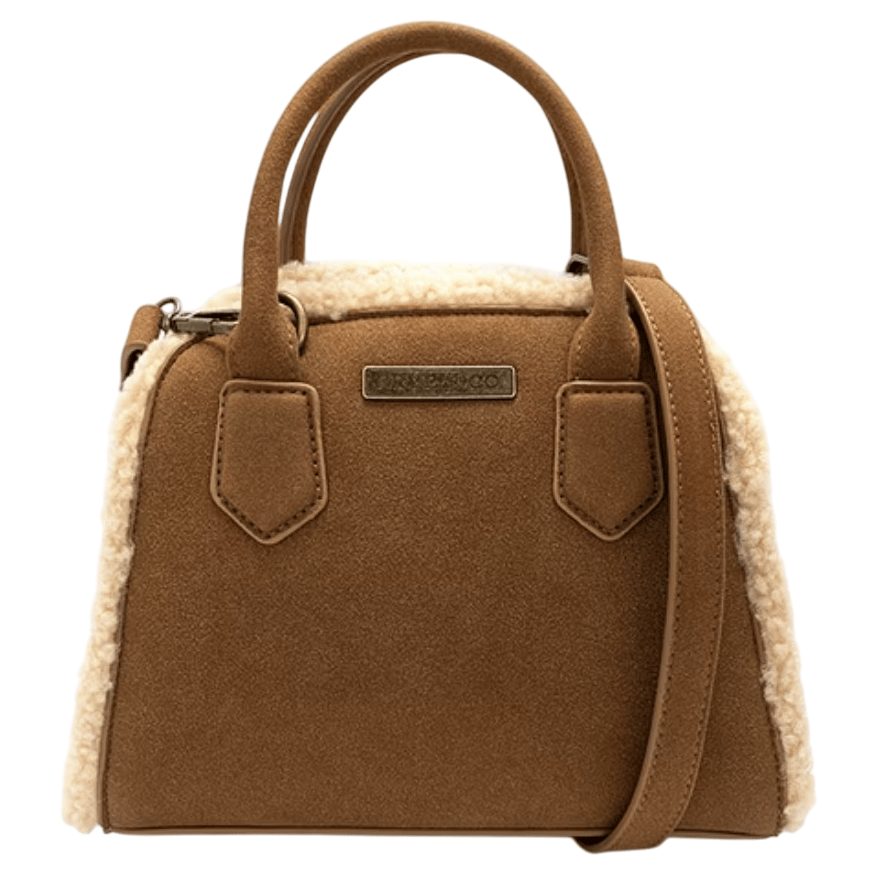 A brown handbag with a soft, plush texture and shearling trim features two handles, a shoulder strap, and a front logo plaque.
