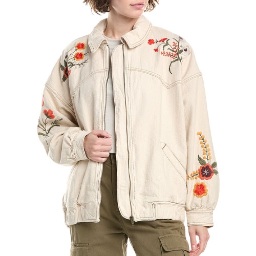 A cream-colored jacket with floral embroidery on the shoulders and sleeves, paired with olive green cargo pants.