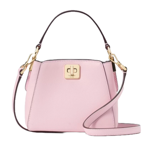 A small pink handbag with a top handle and detachable shoulder strap, featuring gold-tone hardware and a turn-lock closure.