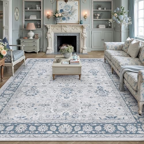 A living room with a vintage-style floral area rug, a traditional-style fireplace, a floral-patterned sofa, a coffee table, and decorative shelving filled with books and vases.