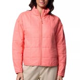 Coral pink quilted jacket with a front zipper, high collar, and long sleeves, paired with beige pants.