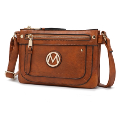 Brown faux leather crossbody bag with gold-tone hardware, featuring a front zipper pocket and a circular emblem with the letter \“M.\“