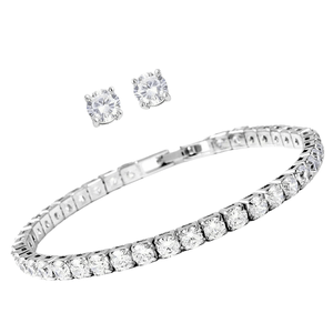 A silver bracelet with clear stones arranged in a row and a pair of matching stud earrings, each featuring a clear stone.