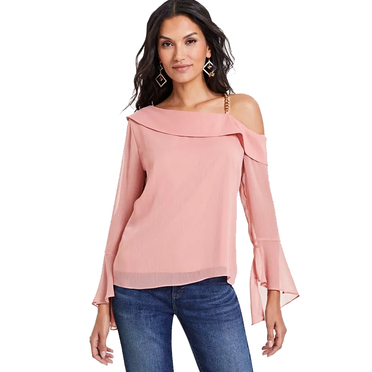 A blush-pink top featuring an asymmetric neckline with one bare shoulder accented by a gold chain strap and long sleeves with flared cuffs.