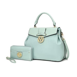A mint green MKF satchel and wallet set featuring a structured handbag with a top handle, detachable shoulder strap, and a flap closure adorned with a gold-tone logo pendant, paired with a matching wristlet wallet.
