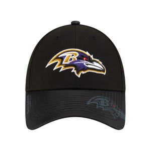 A black baseball cap featuring the Baltimore Ravens logo in purple, gold, and white embroidery on the front. The cap also has a subtle pattern of the logo on the brim.