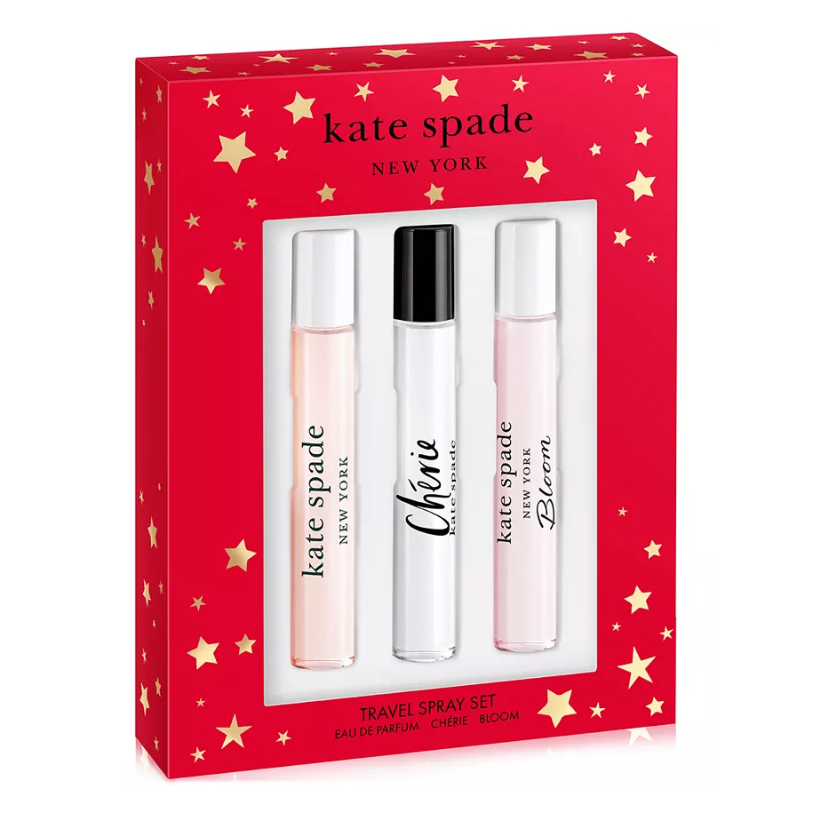 The Kate Spade 3pc Travel Spray Set includes three fragrances: Eau de Parfum, Chérie, and Bloom. Each spray is neatly packaged in a festive red box with gold stars.