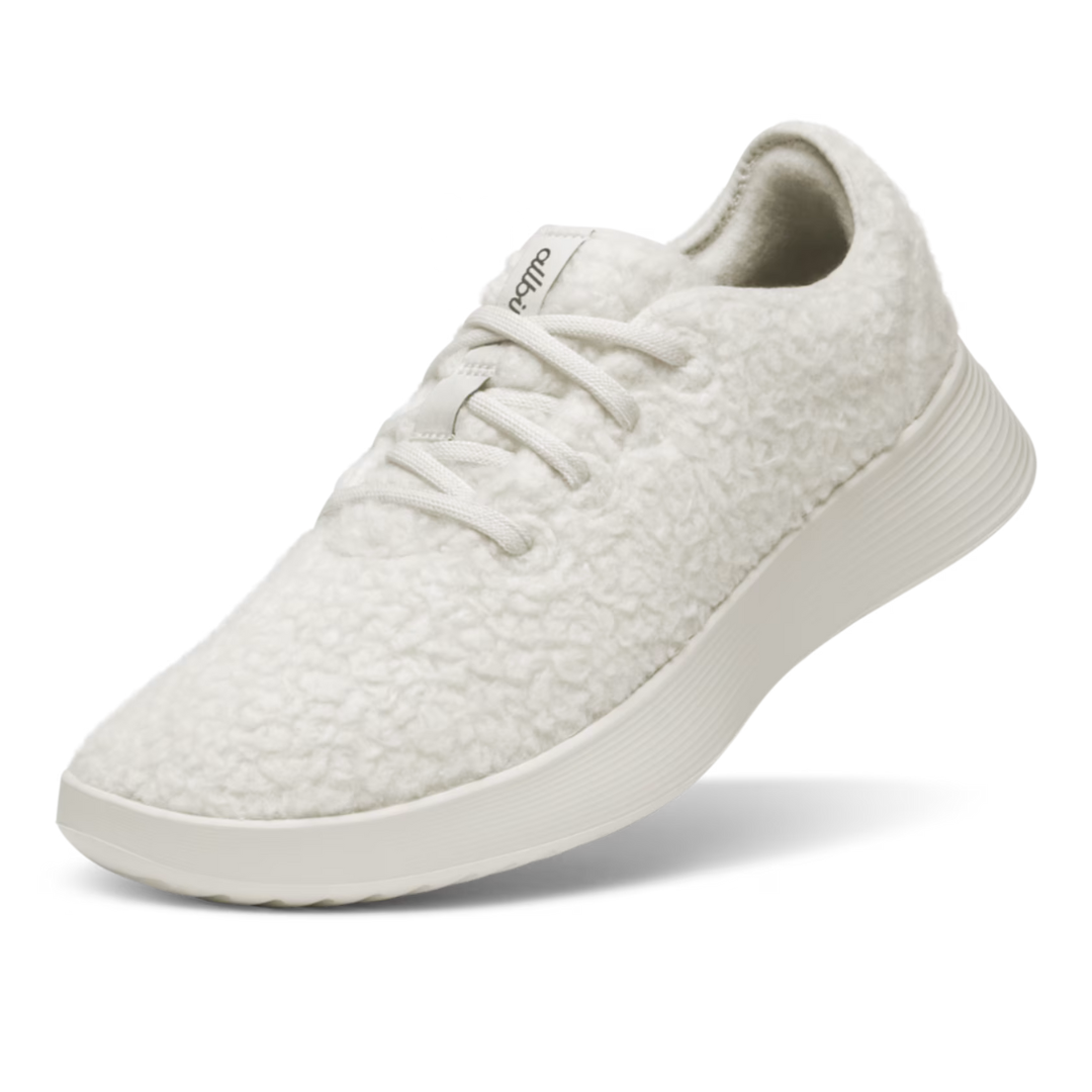 White lace-up sneaker with a textured, wool-like upper and a smooth, slightly ribbed sole.