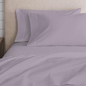 A lavender queen sheet set made of 100% cotton percale, featuring a smooth texture and including a fitted sheet, flat sheet, and two pillowcases.