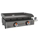 Two-burner Blackstone tabletop gas griddle featuring a flat cooking surface with side shields, ignition knobs, and a propane connection on the side.