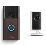 Ring video doorbell with a brown faceplate next to a white indoor security camera on a stand.