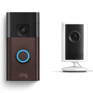 Ring video doorbell with a brown faceplate next to a white indoor security camera on a stand.