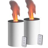 Two cylindrical electric fireplaces with a flame effect, accompanied by remote controls.
