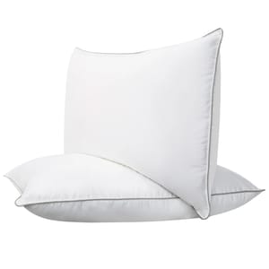 The 2pk Down Hybrid Pillows feature a white, densely filled design with subtle gray piping around the edges, combining supportive memory foam and soft down for balanced comfort.