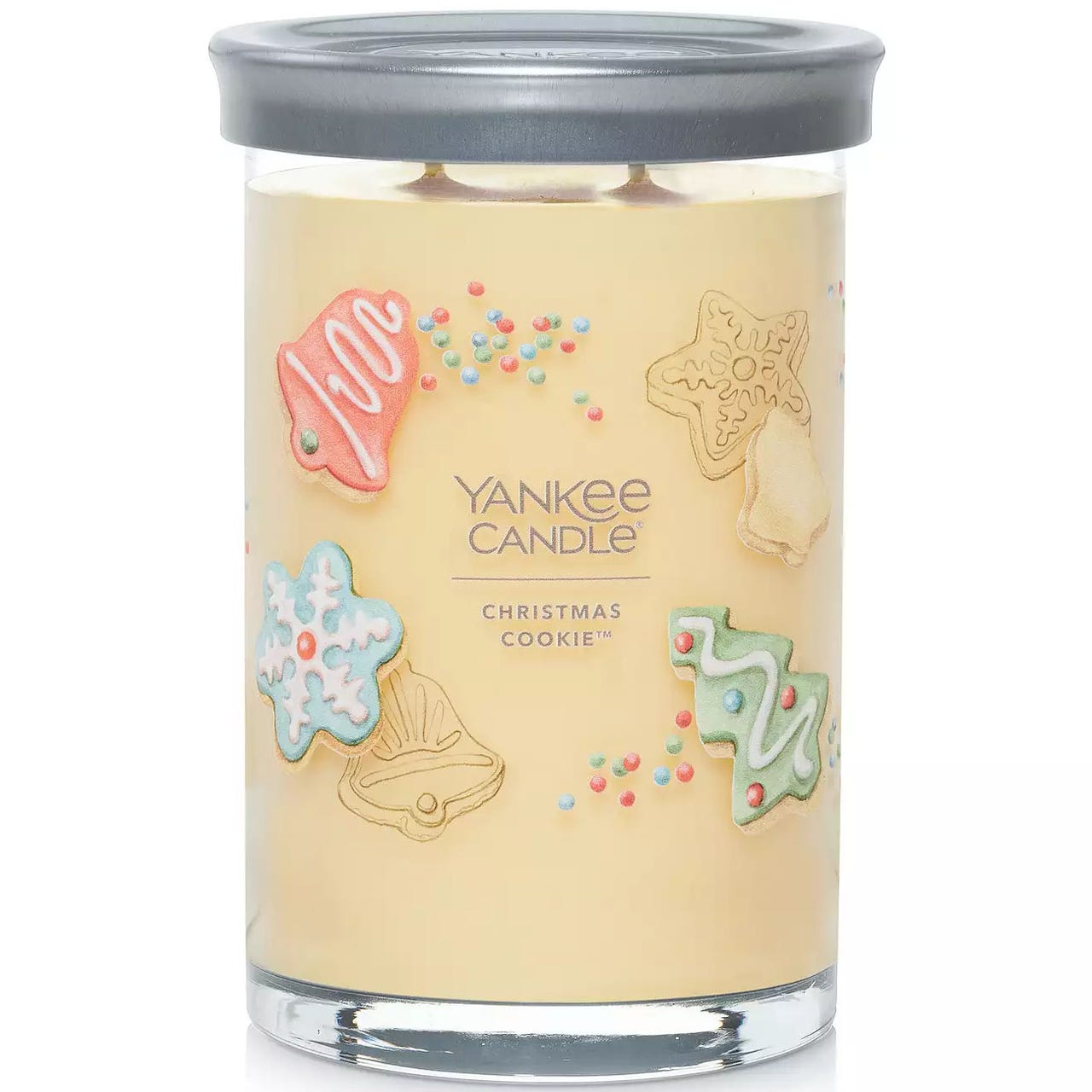 Large Yankee Candle, Christmas Cookie scent, in a glass jar with a gray lid features festive designs of decorated cookies and colorful sprinkles.