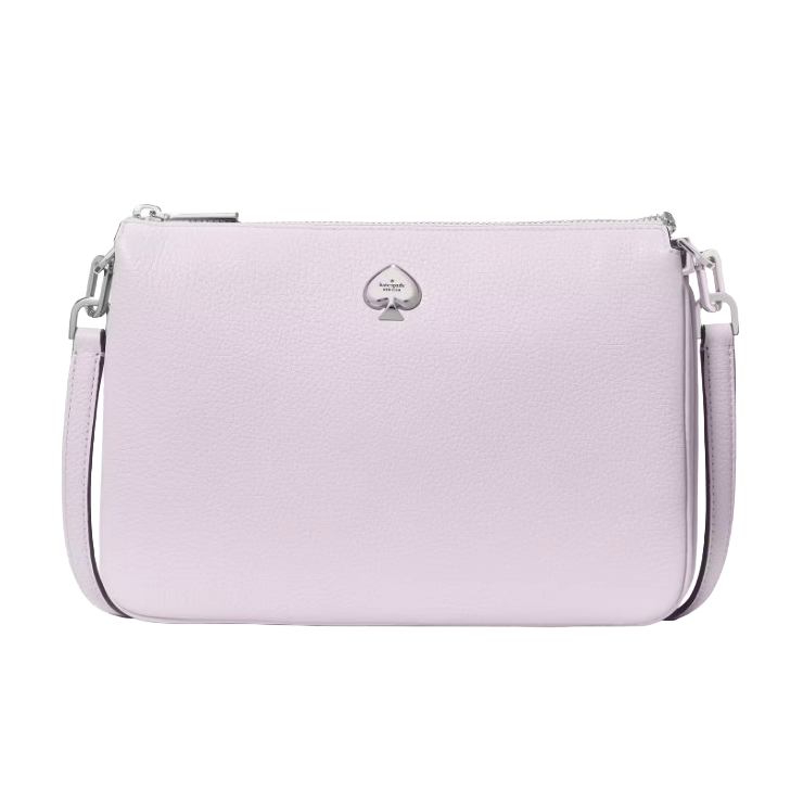A light purple crossbody bag featuring a textured surface and a silver spade logo emblem on the front, complete with an adjustable shoulder strap and zip closure.