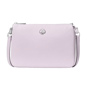 A light purple crossbody bag featuring a textured surface and a silver spade logo emblem on the front, complete with an adjustable shoulder strap and zip closure.