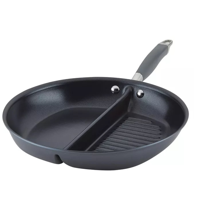 A round, dual-section pan with a divider separating a smooth cooking surface and a ridged grill surface, featuring a handle for easy use.