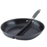 A round, dual-section pan with a divider separating a smooth cooking surface and a ridged grill surface, featuring a handle for easy use.