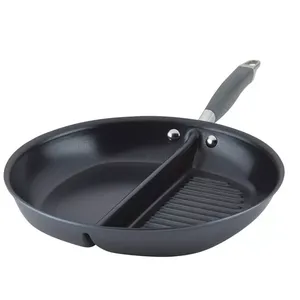 A round, dual-section pan with a divider separating a smooth cooking surface and a ridged grill surface, featuring a handle for easy use.