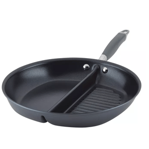 A round, dual-section pan with a divider separating a smooth cooking surface and a ridged grill surface, featuring a handle for easy use.