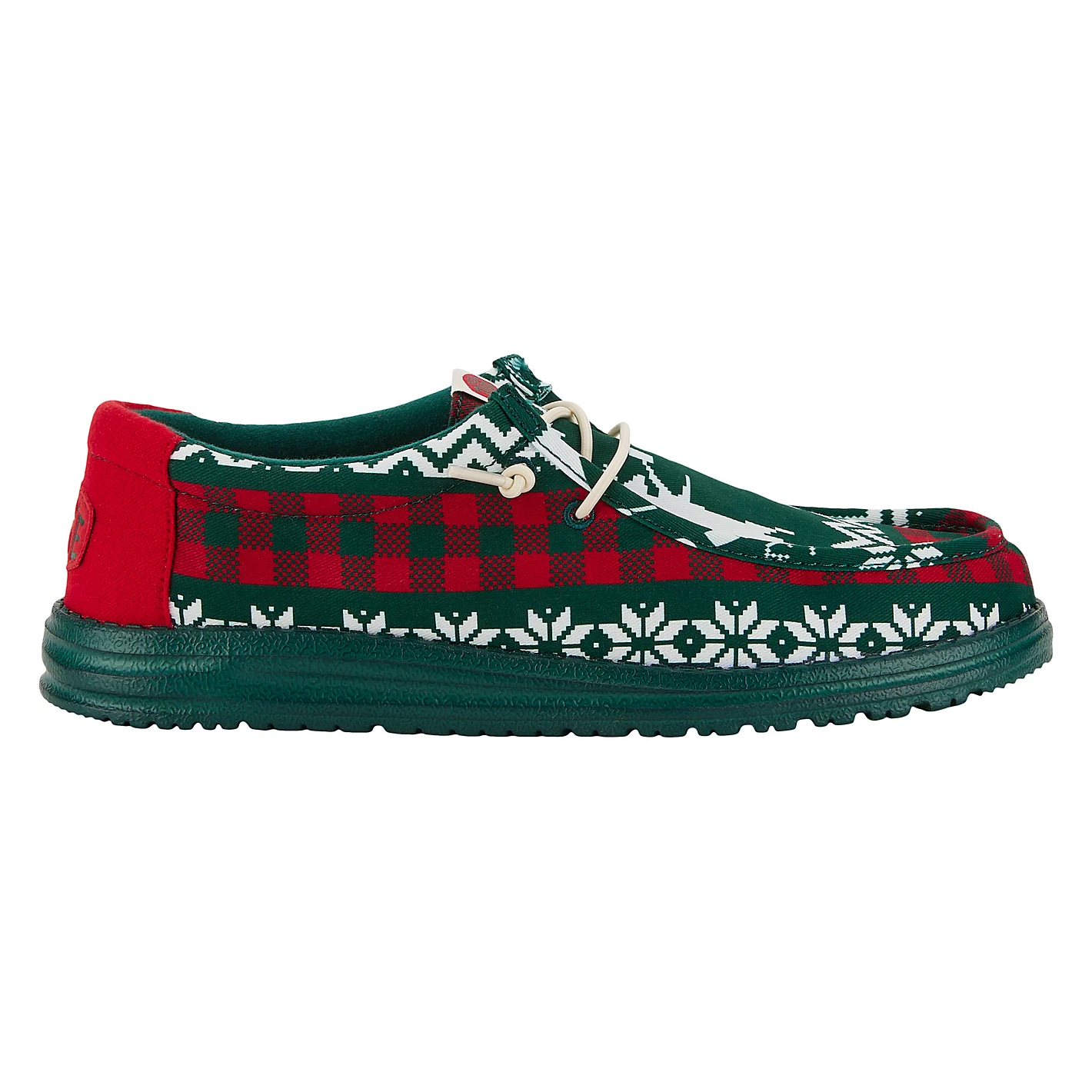 Hey Dude Wally Holiday Shoes feature a festive design with red and green patterns, including checkerboard and snowflake motifs. They have a lightweight sole and white laces for a comfortable, casual fit.
