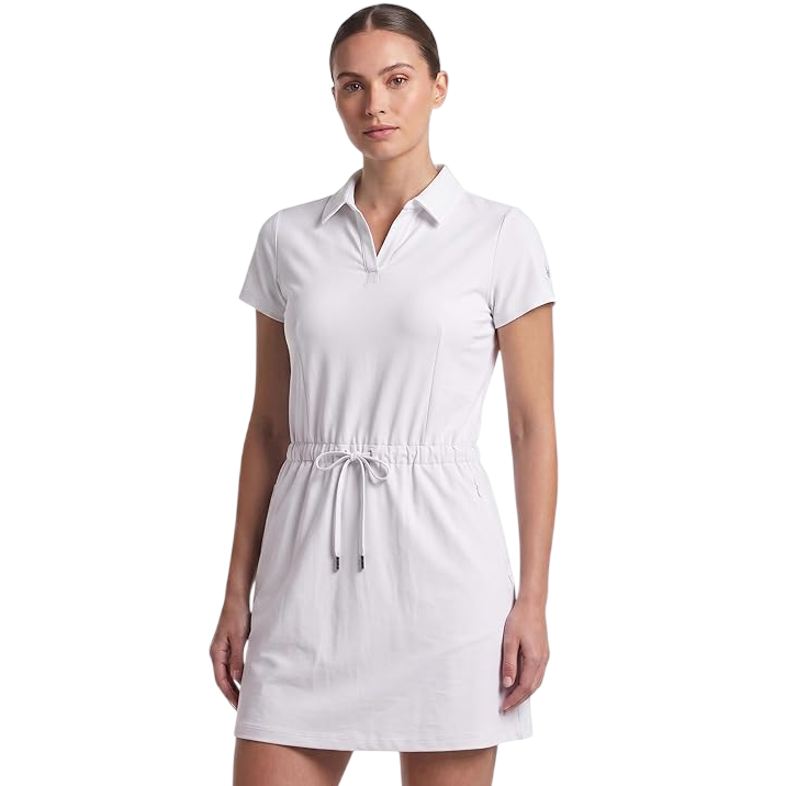 Woman wearing a white short-sleeve dress with a collar and drawstring waist.
