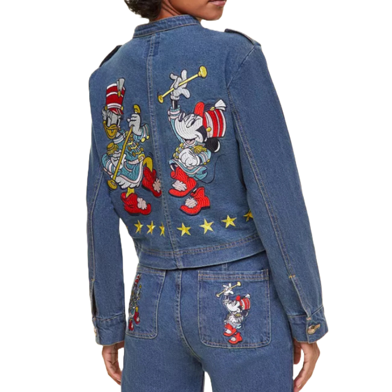 Denim jacket with colorful embroidered characters on the back, featuring Minnie Mouse as a majorette and other embellishments.