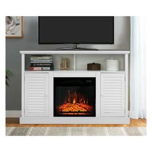 A white TV stand with a built-in electric fireplace and louvered cabinet doors, supporting a flat-screen TV, with a book and decorative items on the open shelf.