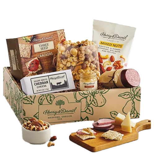 Gift box with cheddar cheese, sausage, mixed nuts, three-seed crackers, honey mustard dip, and Moose Munch popcorn.