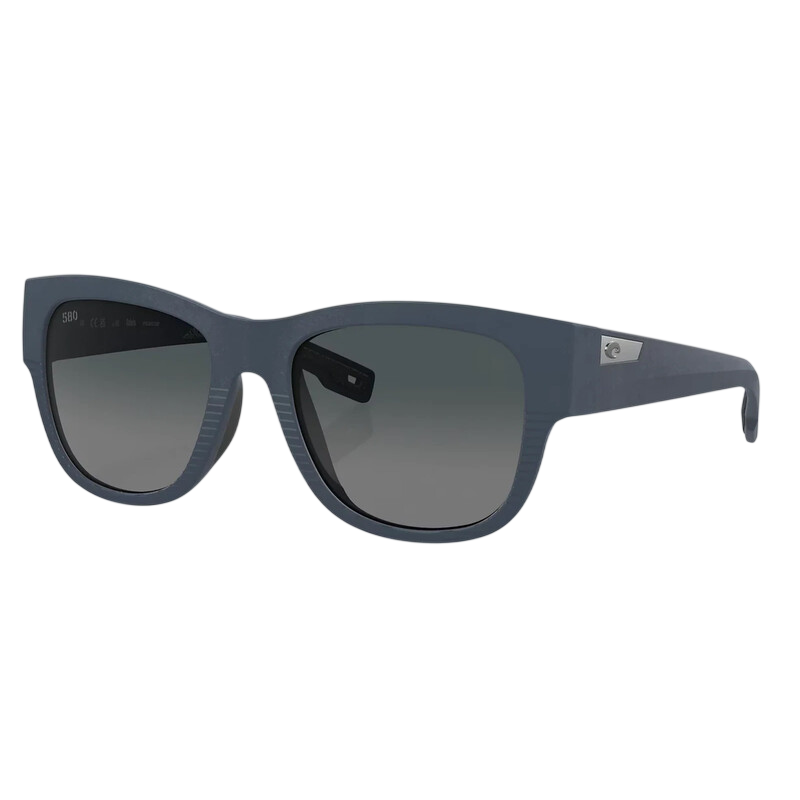 A pair of rectangular sunglasses with dark lenses and matte blue frames, featuring a subtle metallic logo on the temples.
